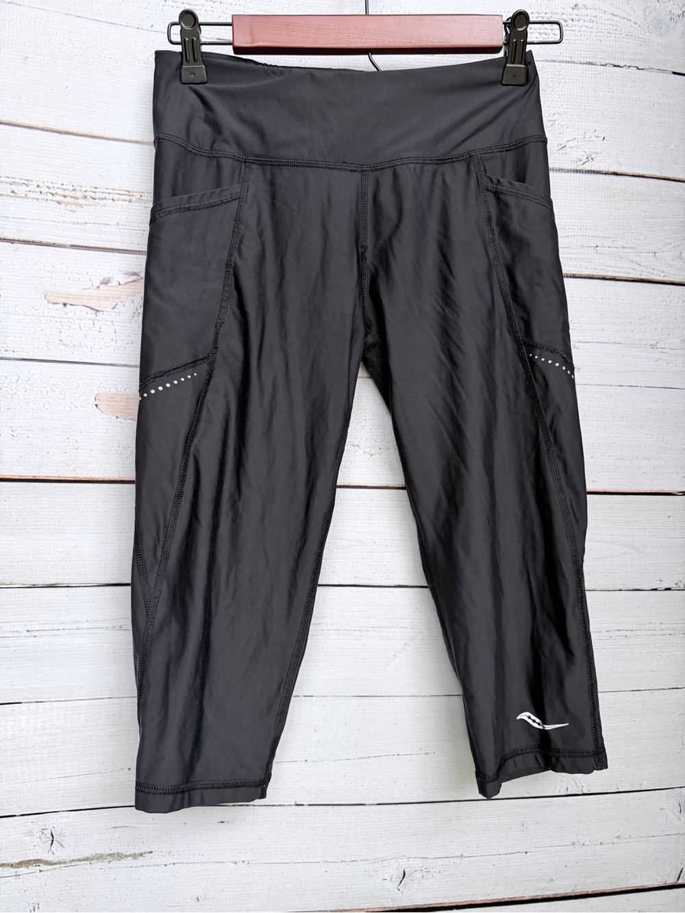 Saucony Black Capri Leggings with Side Pockets and Reflective Dots